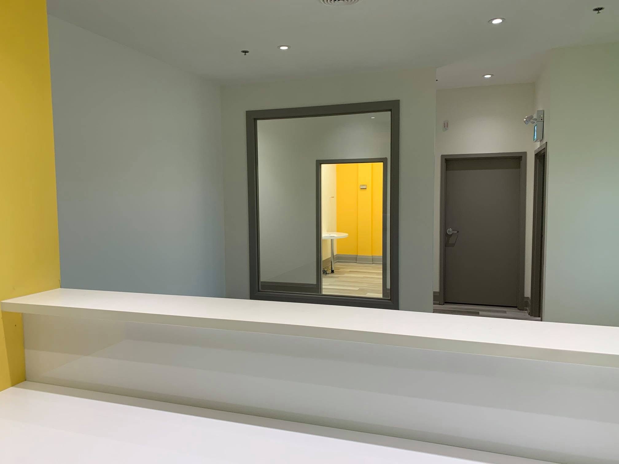 Interior observation window supporting staff visibility